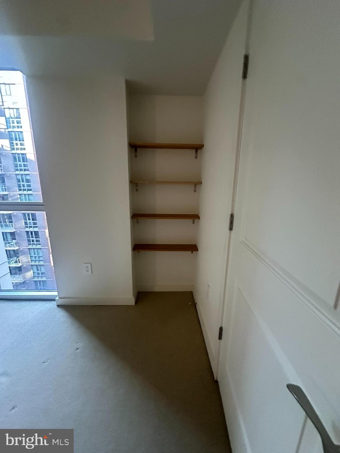 1025 First Street Southeast, Unit 901 Washington, DC 20003 - Photo 21 of 56 wooden floor in an empty room with a window