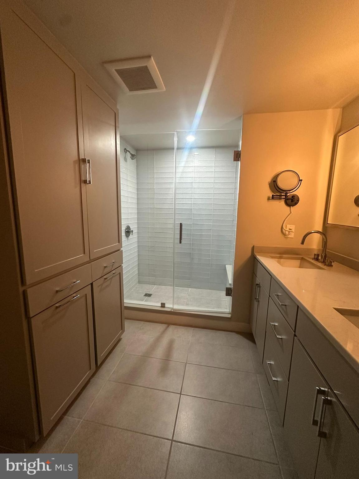 1025 First Street Southeast, Unit 901 Washington, DC 20003 - Photo 24 of 56 a bathroom with a shower and a sink