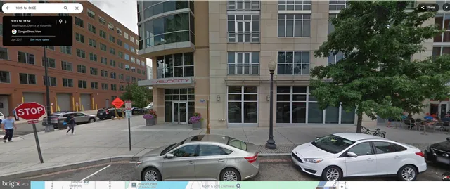 a front view of a building with parking space