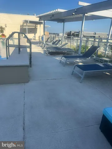 a kitchen with granite countertop a sink and a stove
