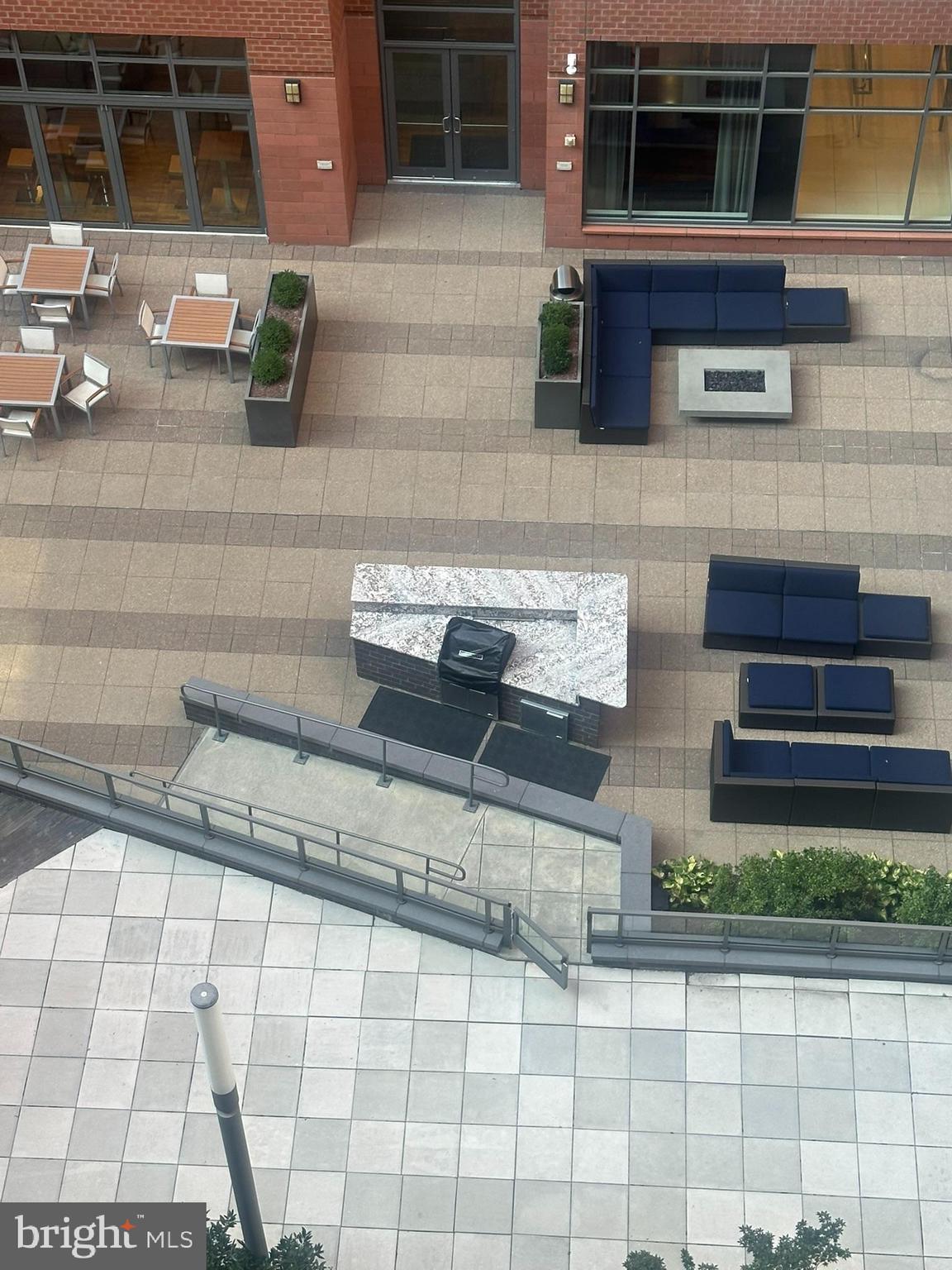 1025 First Street Southeast, Unit 901 Washington, DC 20003 - Photo 53 of 56 a kitchen with granite countertop a sink and a stove