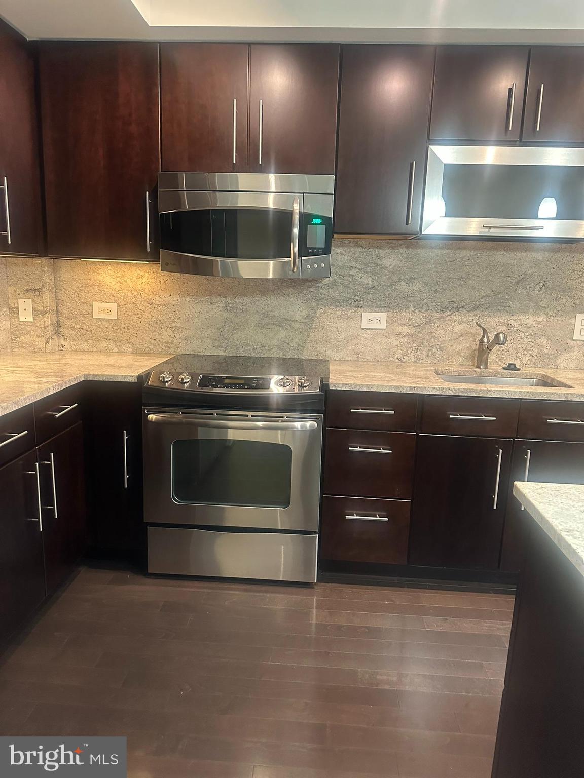 1025 First Street Southeast, Unit 901 Washington, DC 20003 - Photo 9 of 56 a kitchen with a stove and a sink