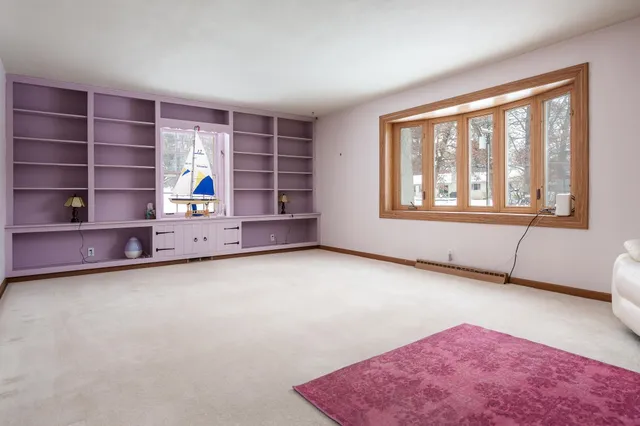 a living room with a couch and a fireplace