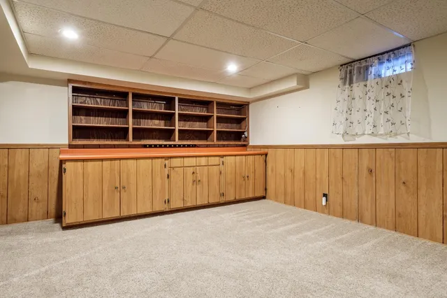 a view of a big room with wooden walls