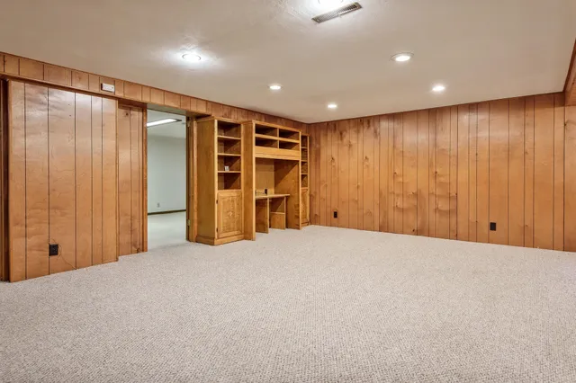 a view of an empty room with a large window
