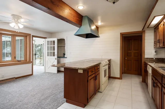 a kitchen with a stove and a refrigerator