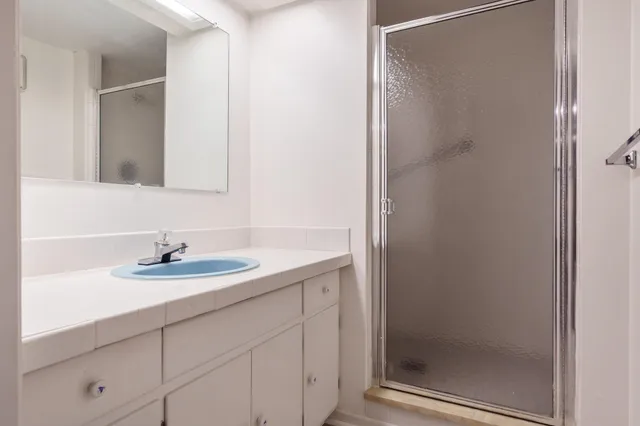 a kitchen with stainless steel appliances granite countertop a stove and a cabinets