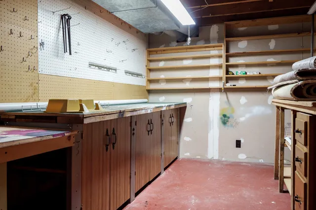 a view of a white house with a road