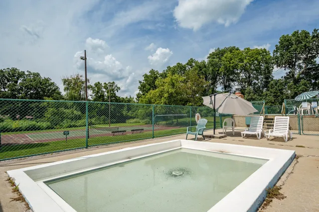 a view of a golf course with a lake view