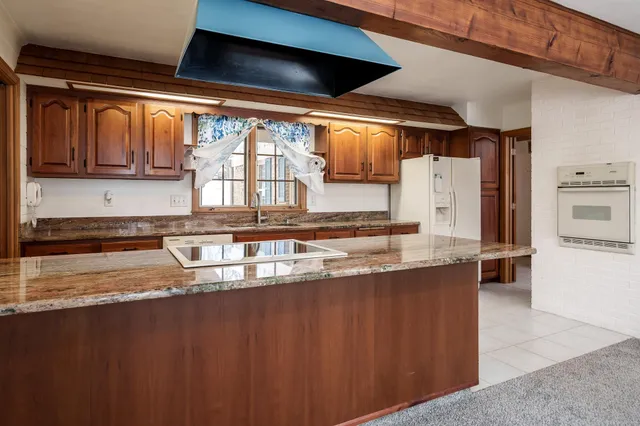 a view of a kitchen with a sink