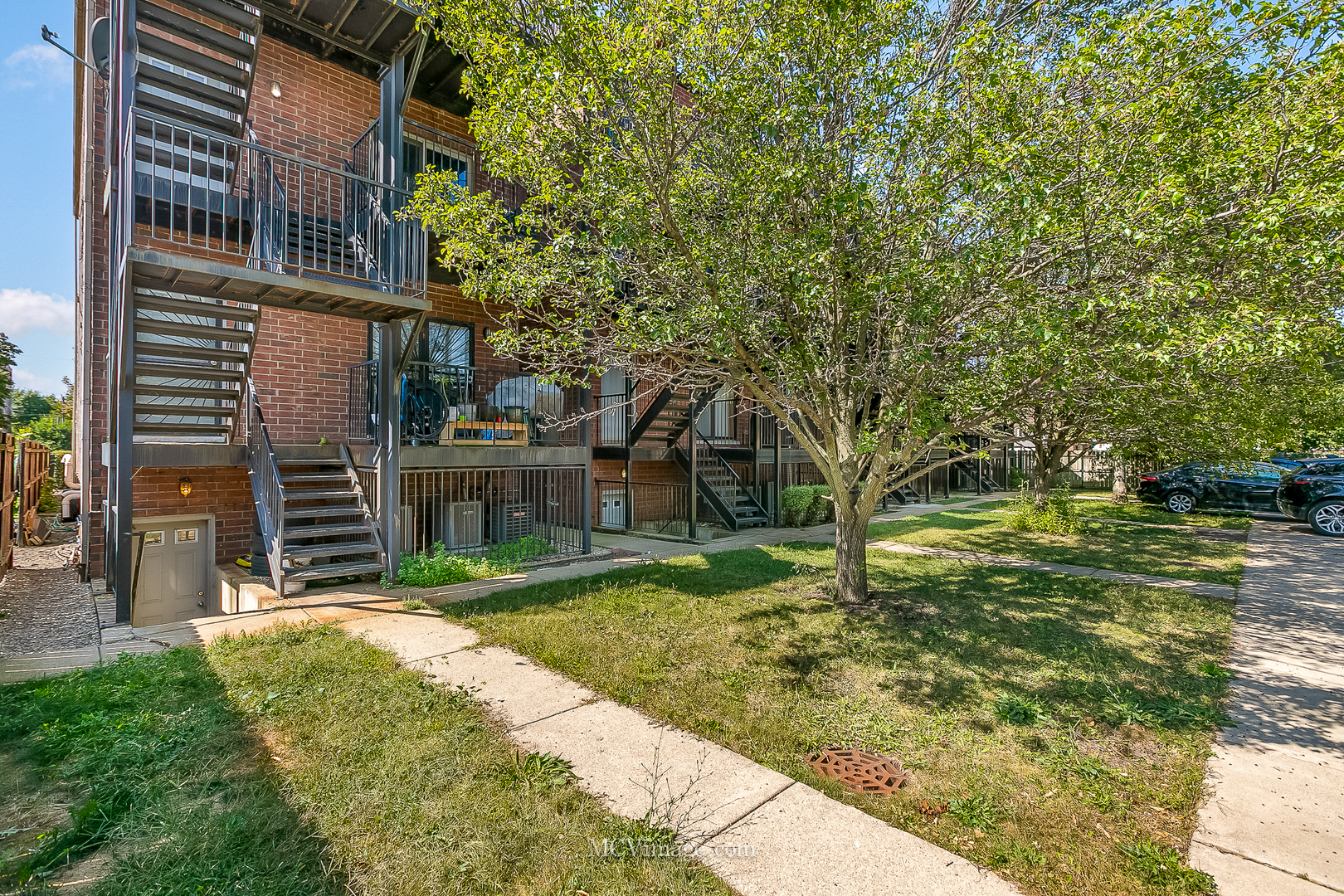 3751 South Michigan Avenue, Unit 2 Chicago, IL 60653 - Photo 11 of 12 a view of a house with a yard