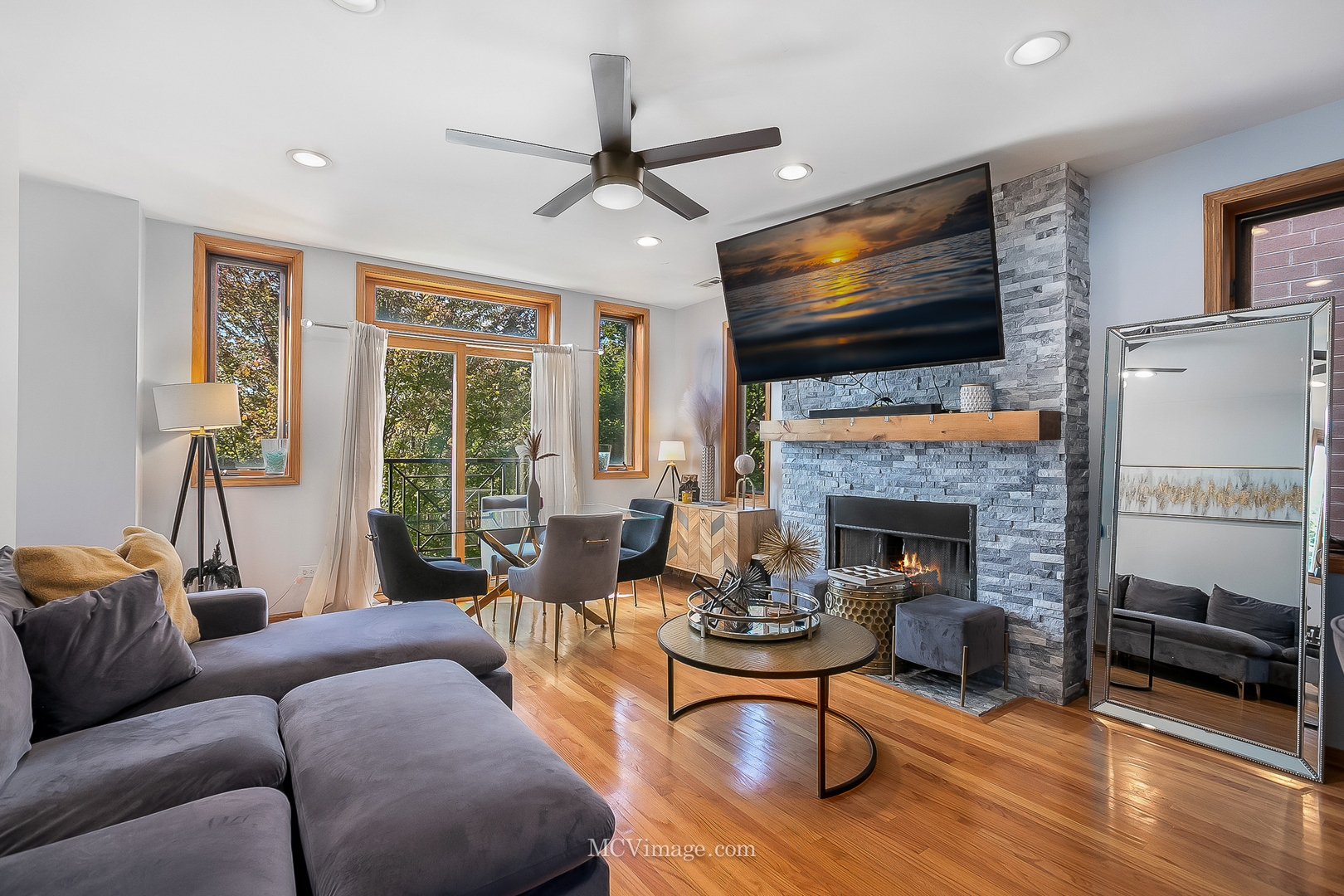 3751 South Michigan Avenue, Unit 2 Chicago, IL 60653 - Photo 2 of 12 a living room with furniture fireplace and a flat screen tv