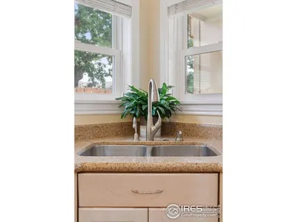 a view of bathroom with granite countertop a potted plant