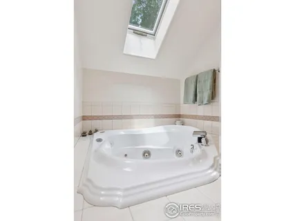 a bath tub sitting in a bathroom next to a white wall