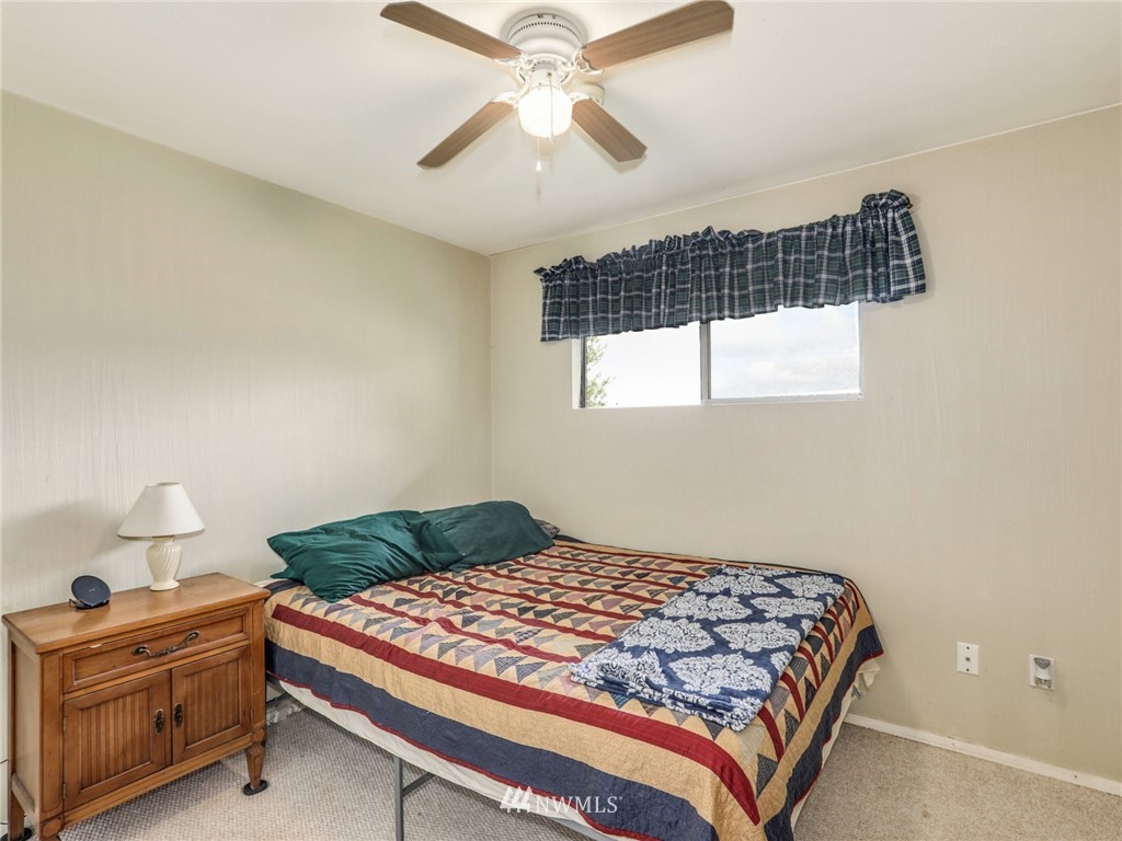20976 Conway Frontage Road Conway, WA 98273 - Photo 14 of 24 a bedroom with a bed and a window