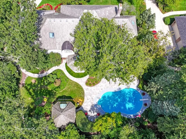 a large kitchen with a table and chairs