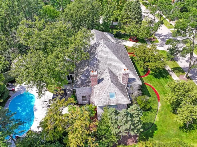 a kitchen with stainless steel appliances granite countertop a refrigerator a stove and a sink with cabinets