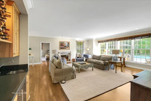 a dining room with wooden floor and window