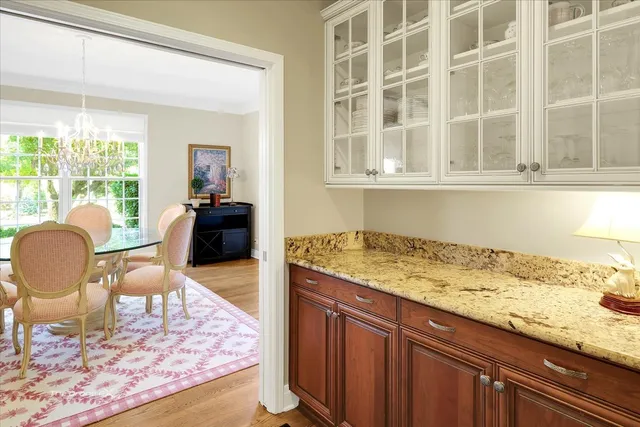 a view of a kitchen with white cabinets
