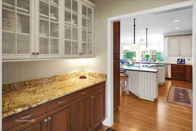 a spacious bedroom with a bed a fireplace and a couch