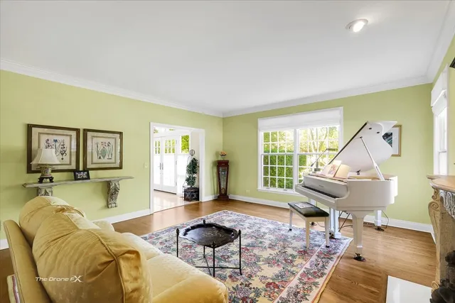 a spacious bathroom with a granite countertop sink a large mirror and a bathtub