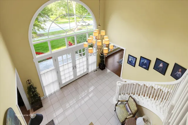 a bedroom with a bed a bookshelf and a book shelf