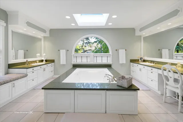 a kitchen with stainless steel appliances kitchen island granite countertop a sink and cabinets