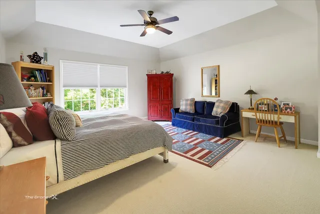 an aerial view of a house with an outdoor space