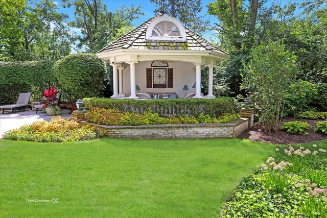 a kitchen with kitchen island granite countertop a sink and stainless steel appliances