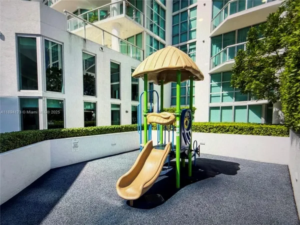 a view of a bench with a table under an umbrella