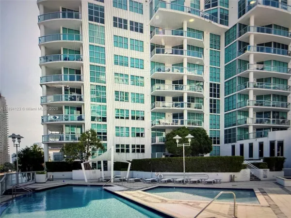 a view of building with swimming pool