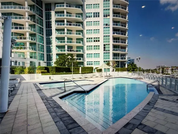 a view of swimming pool with outdoor seating