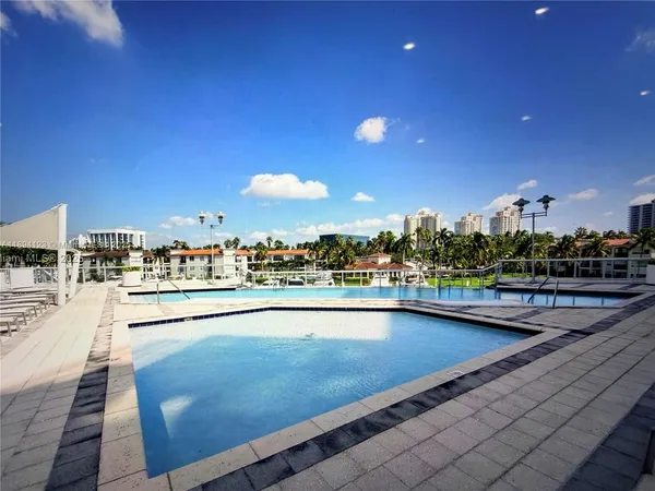 a view of swimming pool with outdoor seating