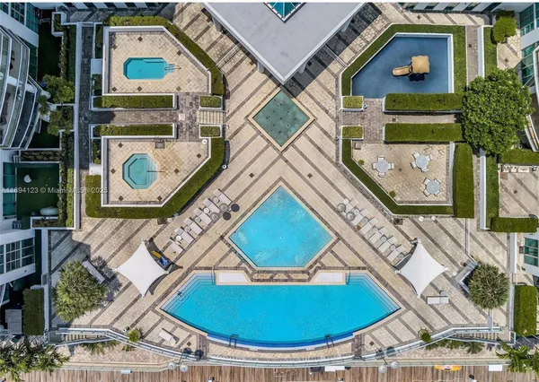an aerial view of a house with a swimming pool