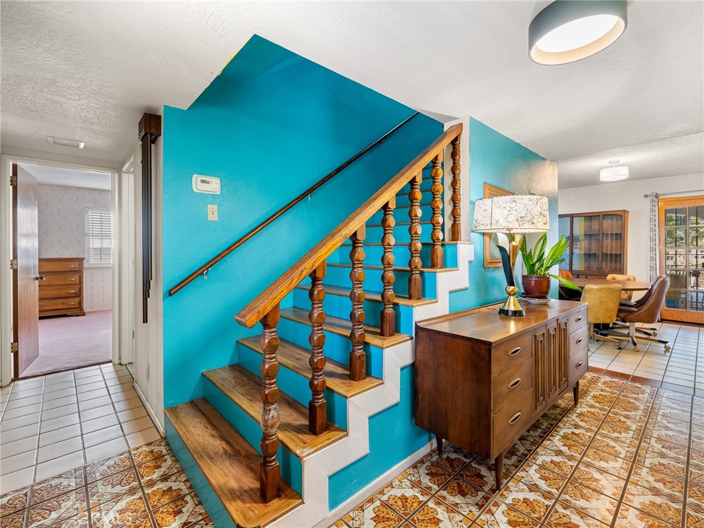 13916 Burning Tree Drive Victorville, CA 92395 - Photo 13 of 49 a living room with furniture and a rug