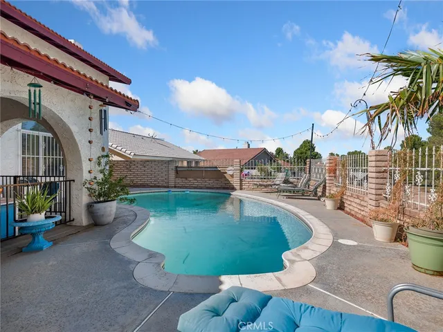 a view of a swimming pool with a patio
