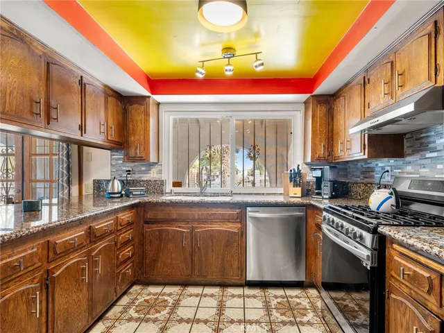 a kitchen with a sink and a stove