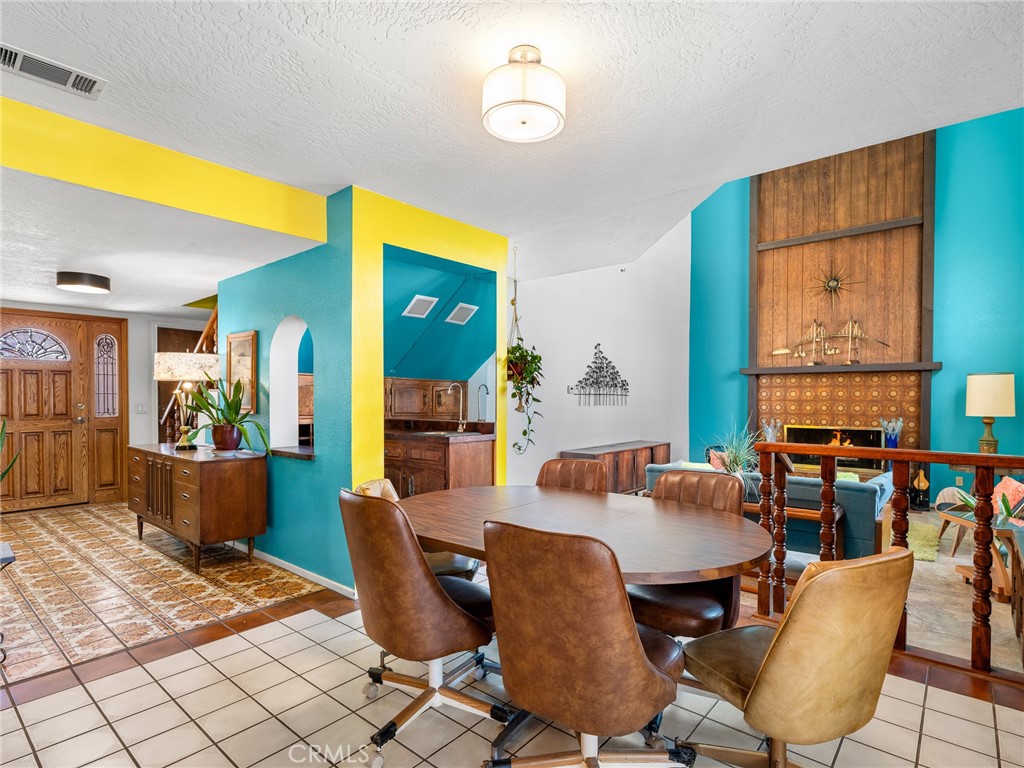 13916 Burning Tree Drive Victorville, CA 92395 - Photo 25 of 49 a dining room with furniture and window