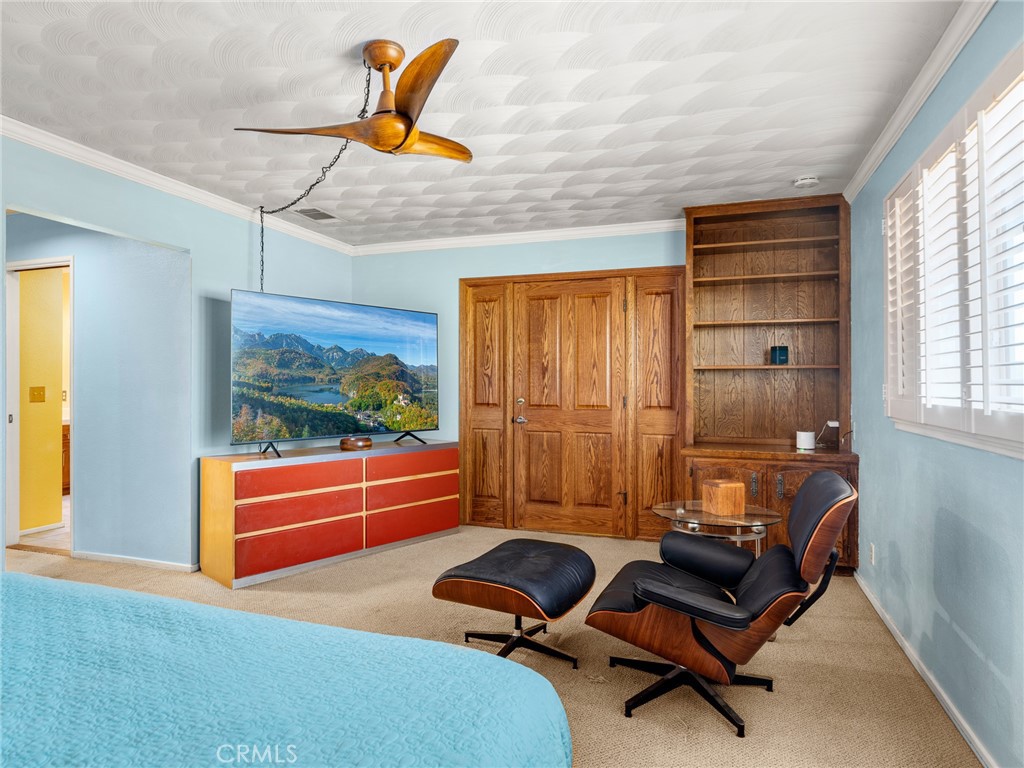 13916 Burning Tree Drive Victorville, CA 92395 - Photo 33 of 49 a room with gym equipment and wooden floor