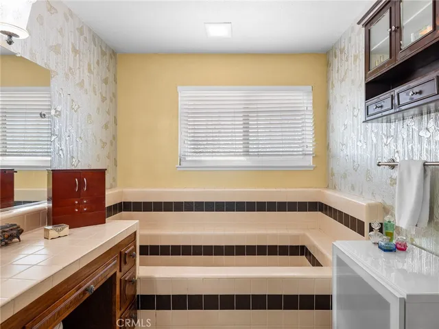 a bathroom with a bathtub and a sink