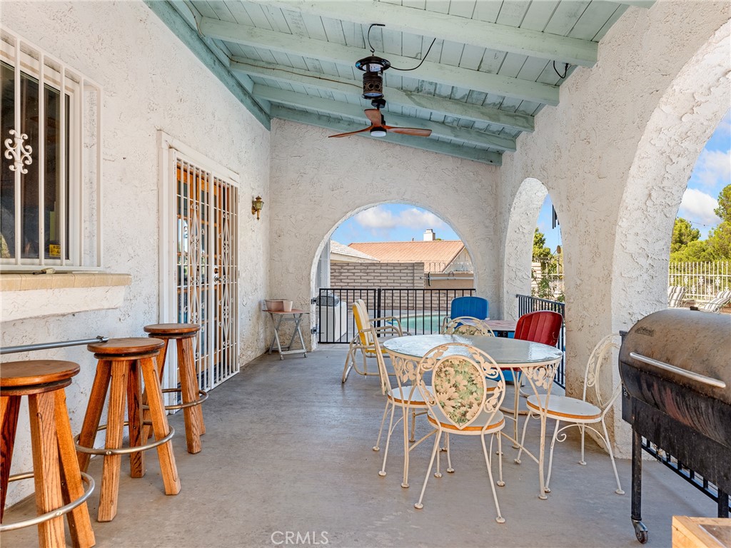 13916 Burning Tree Drive Victorville, CA 92395 - Photo 40 of 49 a view of a dining room with furniture window and outside view
