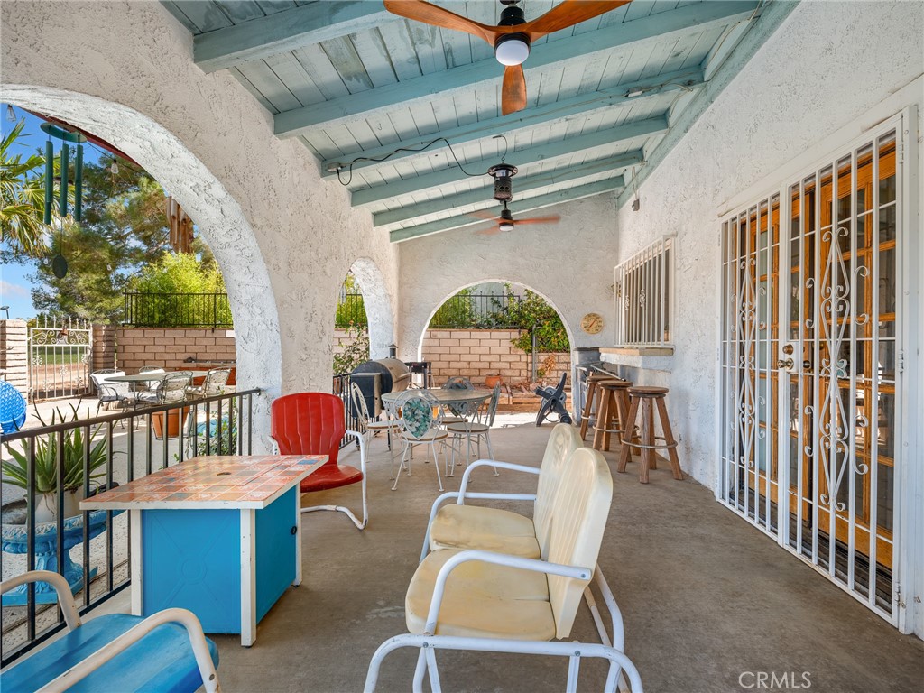 13916 Burning Tree Drive Victorville, CA 92395 - Photo 45 of 49 a view of a dining room with furniture window and outside view
