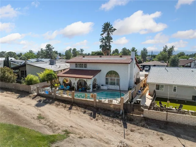 a view of a patio with a table and chairs