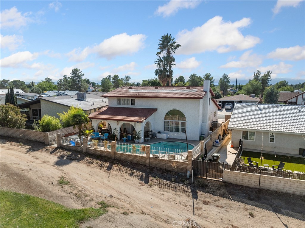 13916 Burning Tree Drive Victorville, CA 92395 - Photo 8 of 49 a view of a patio with a table and chairs