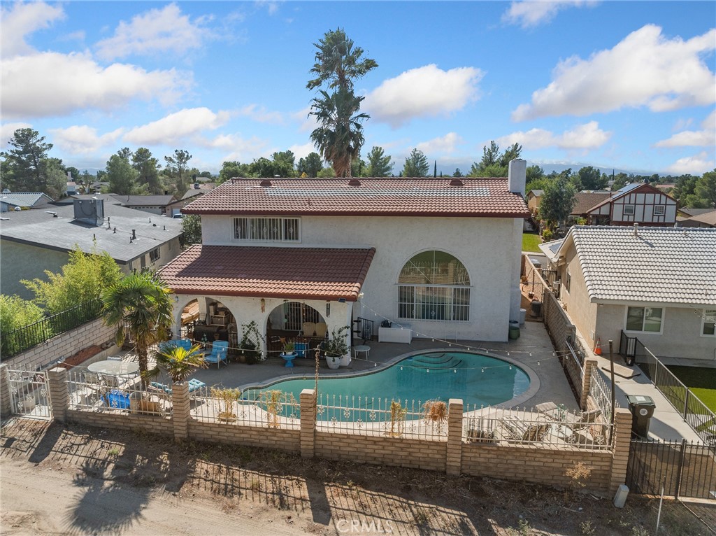 13916 Burning Tree Drive Victorville, CA 92395 - Photo 9 of 49 a front view of a house with garden