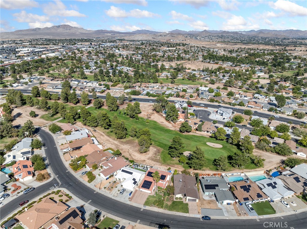 13916 Burning Tree Drive Victorville, CA 92395 - Photo 10 of 49 an aerial view of residential houses with outdoor space
