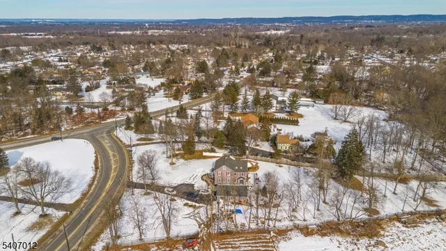 a view of patio with table and chairs under an umbrella