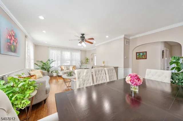 a living room with furniture and flowers