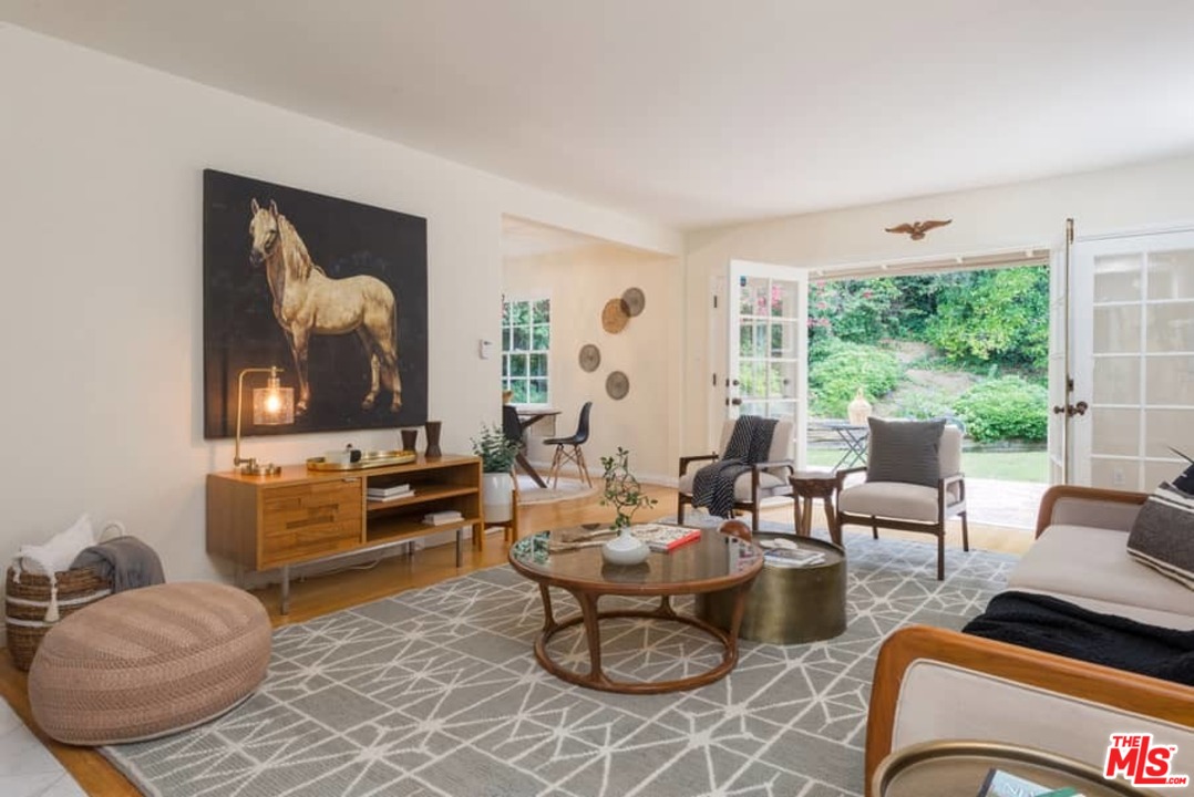 5712 Tellefson Road Culver City, CA 90230 - Photo 1 of 25 a living room with furniture and a large window
