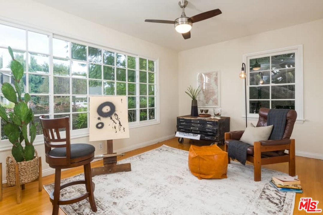 5712 Tellefson Road Culver City, CA 90230 - Photo 12 of 25 a living room with furniture and a floor to ceiling window